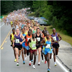 The lead pack leads a mass of runners at the 2010 race. Photo courtesy of Photography by Ann Kaplan in Cape Elizabeth.