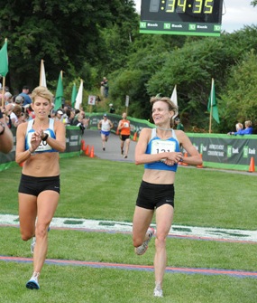 Kristin Barry and Sheri Piers crossing the finish line together at the 2010 TD Bank Beach to Beacon 10K Road Race