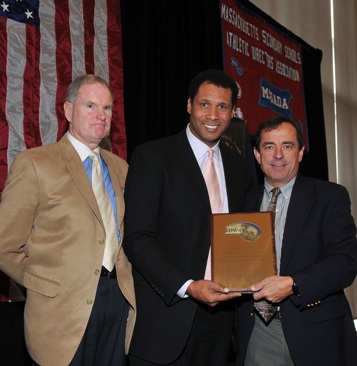 William Gaine, the MIAA Deputy Director (left) and Steve Burton of WBZ-TV (center) present Dave McGillivray, president of DMSE Sports, Inc., with the 2010 Ron Burton Community Service Award.