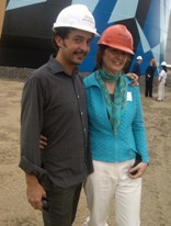 Artist Jaime Gili and Jean Maginnis, executive director of The Maine Center for Creativity, in front of the first painted oil storage tank in South Portland, Maine
