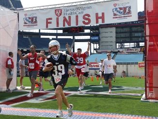 Participants in the Harvard Pilgrim 10K at Patriot Place will see themselves on the huge video screen inside Gillette Stadium as they cross the midfield finish line