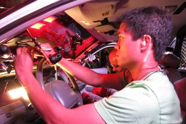 Radiant Images technicians outfit a squad car with cameras and accessories for End of Watch