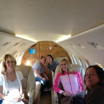 Grand prize winners in the first-ever Maine Suitcase Party inside Maine Aviation's Hawker 1000 jet before return trip to Portland from NYC weekend.